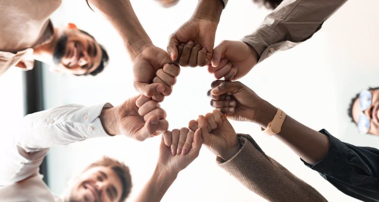 Teamwork, Power And Partnership - Workers Doing Fist Pump While Celebrating A Good Job